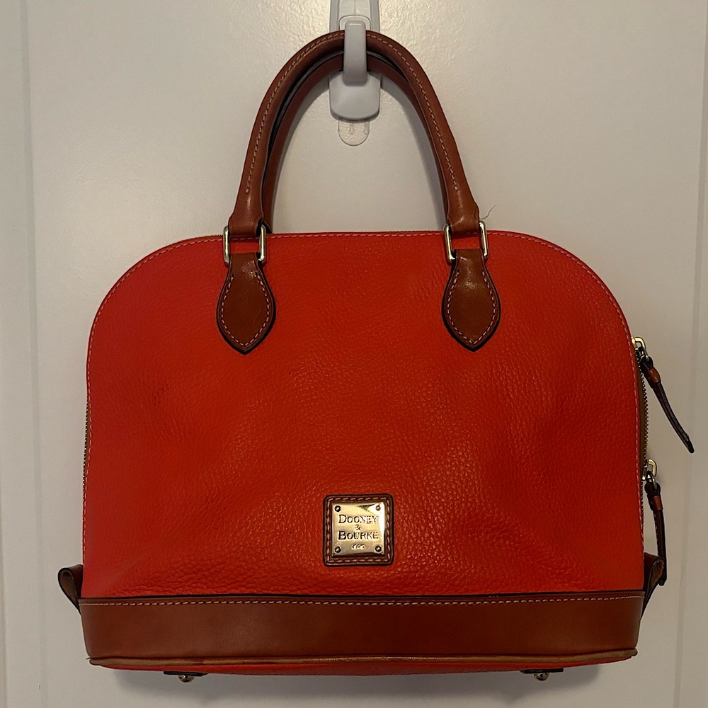 Gently used Dooney & Bourke Pebblr Grain Zip Zip Satchel in orange and tan